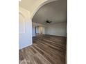 Spacious living room featuring wood-look floors and a ceiling fan at 813 S Doran Cir, Mesa, AZ 85204