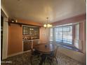 Bright dining area features a built-in hutch and window seat at 1041 E 9Th Dr, Mesa, AZ 85204