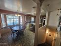 Kitchen and dining area with island and staircase at 1041 E 9Th Dr, Mesa, AZ 85204