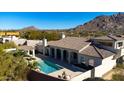 Luxury home with pool and spa, scenic mountain backdrop at 10452 E Quartz Rock Rd, Scottsdale, AZ 85255