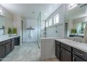 Spa-like bathroom with double sinks, a large shower, and modern finishes at 10538 E Sheffield Dr, Mesa, AZ 85212