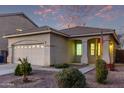 One-story house with a two-car garage and landscaped front yard at 12418 W Pima St, Avondale, AZ 85323