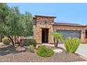 Attractive single-story home with desert landscaping and a two-car garage at 12736 W Auburn Dr, Peoria, AZ 85383