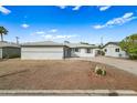 Front view of a single story home with a neat lawn at 1312 E Colter St, Phoenix, AZ 85014