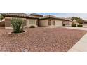 Front yard view of a single-story house with rock landscaping at 13292 W Statler St, Surprise, AZ 85374