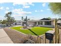 Charming single story home with a cactus and nicely landscaped yard at 14402 N 45Th St, Phoenix, AZ 85032