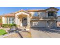 Two-story house with solar panels, landscaped yard, and double garage at 1684 E Coconino Dr, Chandler, AZ 85249