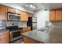 Modern kitchen with granite countertops and stainless steel appliances at 200 E Southern Ave # 118, Tempe, AZ 85282