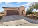 House exterior showcasing a garage and desert landscaping at 20515 N 274Th Ln, Buckeye, AZ 85396