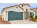 New construction home with green garage door and desert landscaping at 2891 N Westridge Ln, Casa Grande, AZ 85122