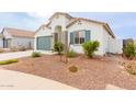 New construction home with green garage door and desert landscaping at 2891 N Westridge Ln, Casa Grande, AZ 85122