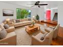 Bright living room featuring hardwood floors and comfy seating at 2946 E Grove Cir, Mesa, AZ 85204