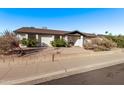 House exterior featuring a front yard, landscaping, and a two-car garage at 3146 S Stewart Cir, Mesa, AZ 85202