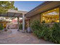 Inviting patio with pergola, fountain, and mountain views at 3921 E San Miguel Ave, Paradise Valley, AZ 85253