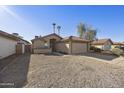 House exterior, showcasing a tan stucco home with a gravel driveway at 4149 W Park Ave, Chandler, AZ 85226