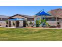 Community playground with shade structure and play equipment at 4296 W Jeanette Ln, San Tan Valley, AZ 85144