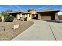 Single story home with curved driveway and two car garage at 4905 W Magellan Dr, New River, AZ 85087