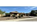 One-story house with a circular turret and well-maintained landscaping at 4905 W Magellan Dr, New River, AZ 85087