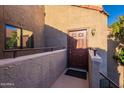 Private condo entry with brown door and small balcony at 5122 E Shea Blvd # 2054, Scottsdale, AZ 85254