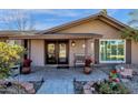 Welcoming front porch with double doors and decorative planters at 537 W El Caminito Dr, Phoenix, AZ 85021