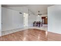 Dining area with hardwood floors and a view into the Gathering room at 6026 W Juniper Ave, Glendale, AZ 85306