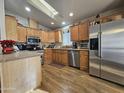 Well-equipped kitchen with stainless steel appliances and ample cabinetry at 650 N Hawes Rd # 4430, Mesa, AZ 85207