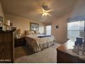 Spacious main bedroom with carpeted floors and ample closet space at 650 N Hawes Rd # 4430, Mesa, AZ 85207