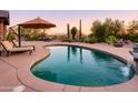 Stunning pool and spa with mountain backdrop at 7002 E Leisure Ln, Carefree, AZ 85377