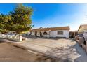 House exterior with front yard and driveway at 7135 W Heatherbrae Dr, Phoenix, AZ 85033