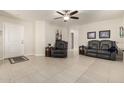 Living room with leather seating and tile flooring at 790 W Jardin Dr, Casa Grande, AZ 85122