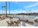 Spacious patio overlooking the lake, perfect for outdoor dining at 8165 E Del Cuarzo Dr, Scottsdale, AZ 85258