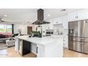 Modern kitchen with white cabinets, quartz countertops, and stainless steel appliances at 8631 E Jackrabbit Rd, Scottsdale, AZ 85250