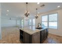 Island kitchen with granite countertops and stainless steel appliances at 910 E Canyon Way, Chandler, AZ 85249