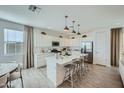 Spacious kitchen with island, stainless steel appliances, and light-colored cabinets at 10165 E Ursula Ave, Mesa, AZ 85212