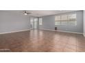 Spacious living room featuring tile floors and lots of natural light at 11402 S 175Th Dr, Goodyear, AZ 85338