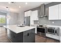 Modern kitchen with stainless steel appliances and island at 16510 N 92Nd St # 1003, Scottsdale, AZ 85260