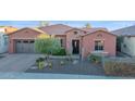 One-story home with brick accents and drought-tolerant landscaping at 1663 E Vesper Trl, Queen Creek, AZ 85140
