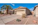 View of the side of the house and driveway at 18064 W Buena Vista Dr, Surprise, AZ 85374
