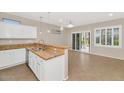 Bright kitchen features granite countertops and white cabinets at 19727 N Wasson Peak Dr, Surprise, AZ 85387