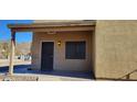 House entrance with a covered porch and security door at 321 S Bridge St, Superior, AZ 85173