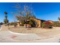 House exterior showcasing a side yard with desert landscaping at 3428 W Vogel Ave, Phoenix, AZ 85051