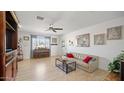 Spacious living room with a piano and large windows at 3737 W Morrow Dr, Glendale, AZ 85308