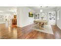 Elegant dining room with hardwood floors and kitchen view at 4030 E Fairmount Ave, Phoenix, AZ 85018