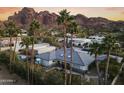 Backyard oasis with pool and expansive mountain backdrop at 4712 E Palo Verde Dr, Phoenix, AZ 85018