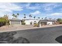 White two-story home with double garage and landscaped yard at 4712 E Palo Verde Dr, Phoenix, AZ 85018