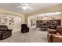 Bright and airy living room features built-in shelving and comfortable seating at 5128 W Pedro Ln, Laveen, AZ 85339