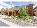 Modern home with wood and metal siding, landscaped yard, and two-car garage at 6525 E Cave Creek Rd # 20, Cave Creek, AZ 85331