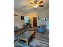 Living room features wood-look floors and neutral color palette at 1042 W Morelos St, Chandler, AZ 85224