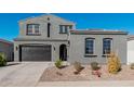 Two-story home with gray exterior, two-car garage, and landscaping at 11054 E Utopia Ave, Mesa, AZ 85212