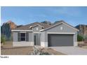 Single-story home with gray exterior and two-car garage at 1402 W Hess Ave, Coolidge, AZ 85128